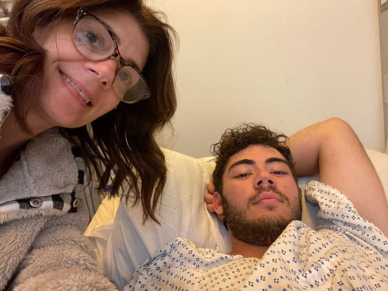 Nick DiCarlo (left) recovering in the hospital with his mom, Nicole Baker, at his side. (Photo courtesy of Nick DiCarlo)
